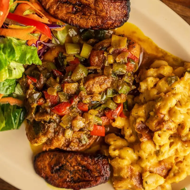 Jerk chicken with fried plantains, green salad and jalapeno mac and cheese.
