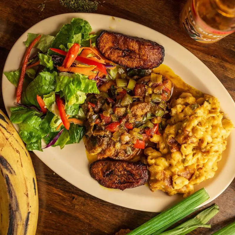 Curry shrimp with plantains, toss salad and jalapeno mac and cheese.