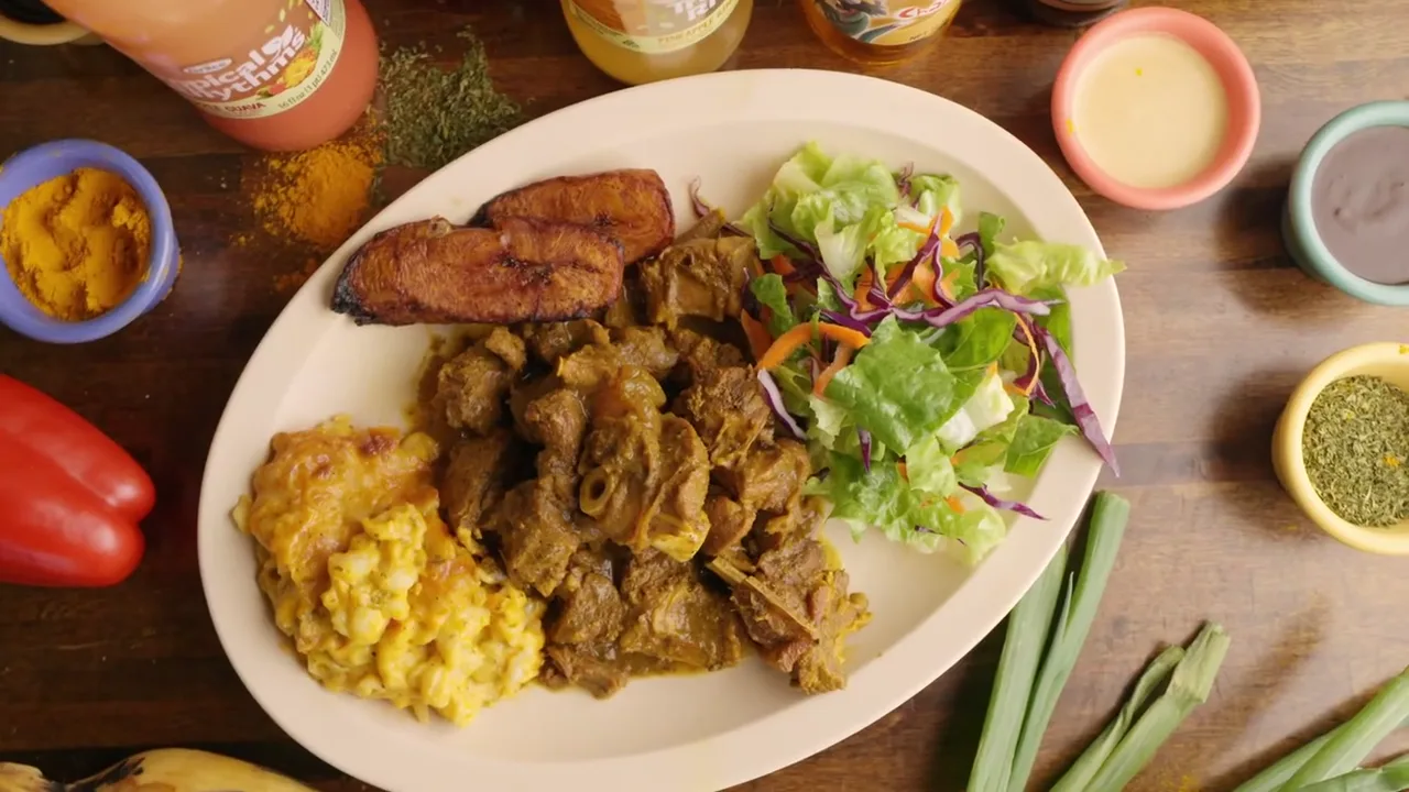 Jerk chicken cooking over the drum in the Ya Mon kitchen
